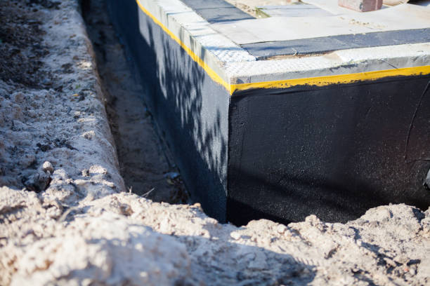 Professional Basement Waterproofing technician working in Elkins Park, PA